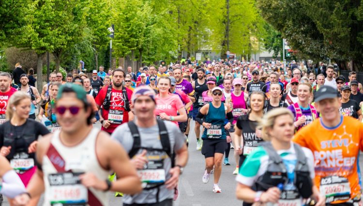 Hundreds of runners running down a London road for the 2026 marathon. | links to article: TPT Trailblazers: Joys and challenges of blind and partially sighted marathoners