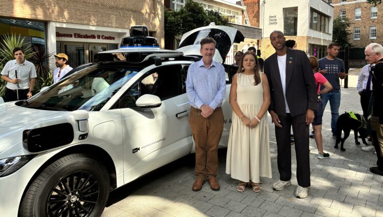TPT Chief Executive Charles Colquhoun, TPT Policy and Campaigns Manager Bhavini Makwana and Waymo representative Nathan Ashley standing in front of the Waymo car. | links to article: Thomas Pocklington Trust and Waymo hold second roundtable discussion on driverless vehicles
